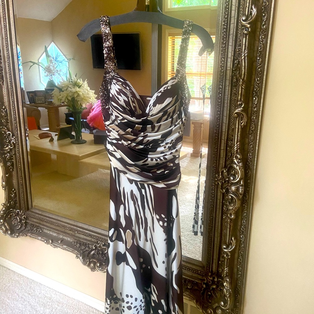 New with tags. Sexy charmeuse animal print dress